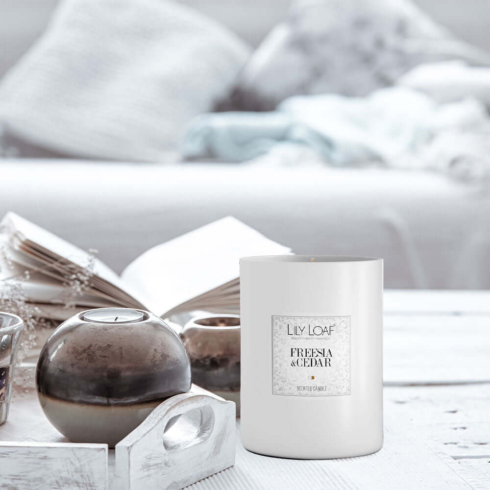 Freesia & Cedar Soy Wax Candle placed up on coffee table
