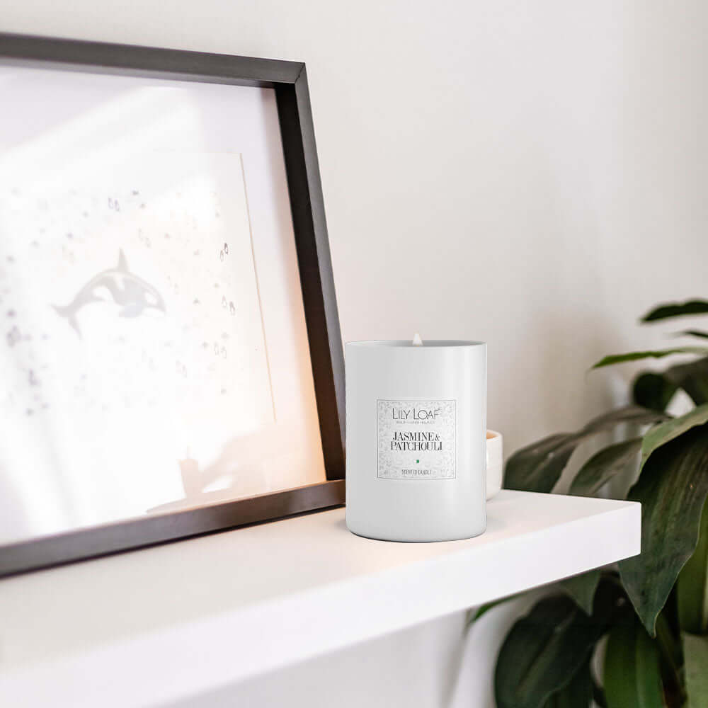 Lily & Loaf Jasmine & Patchouli Soy Wax Candle sat on mantle