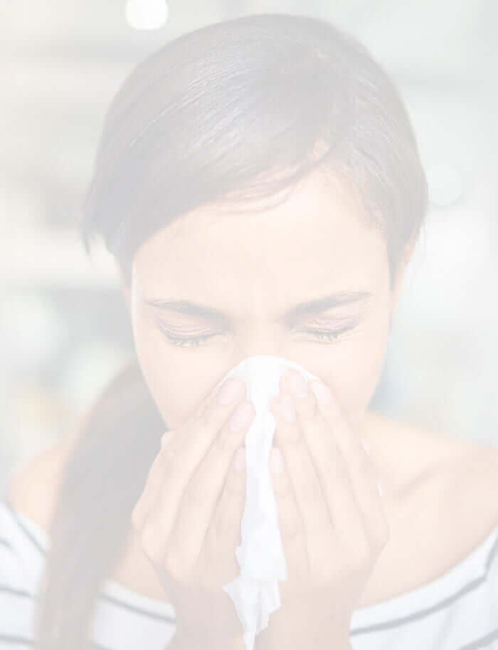mobile version of lady sneezing into a tissue