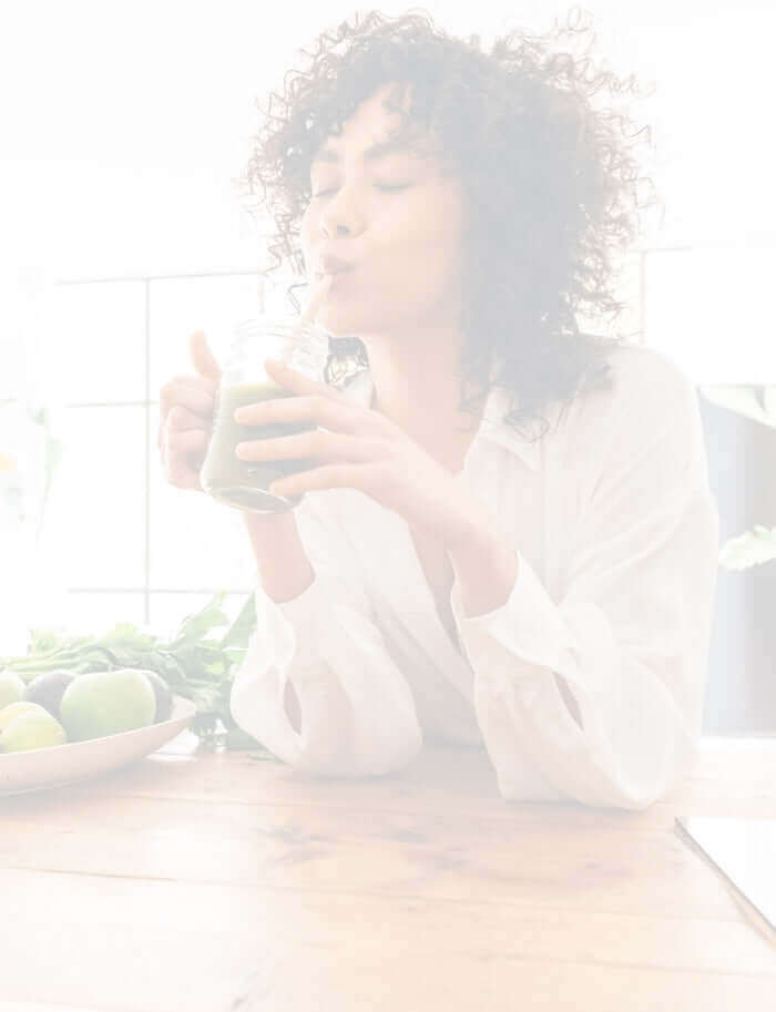lady enjoying a chlorophyll smoothie