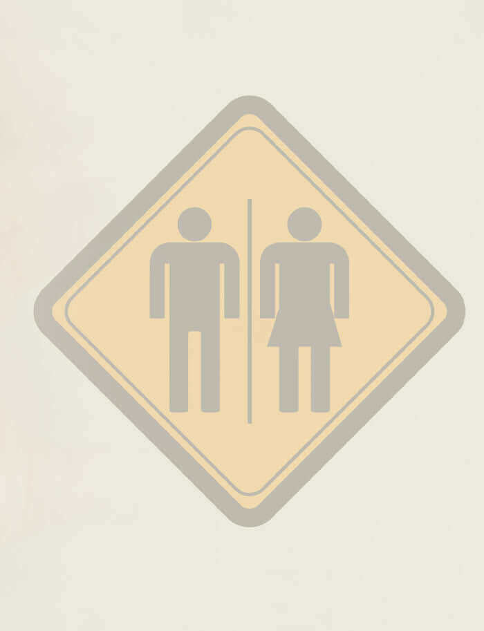 A yellow men's and women's toilet sign