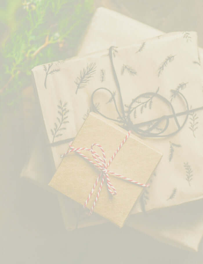Christmas gifts in different sizes wrapped in brown paper