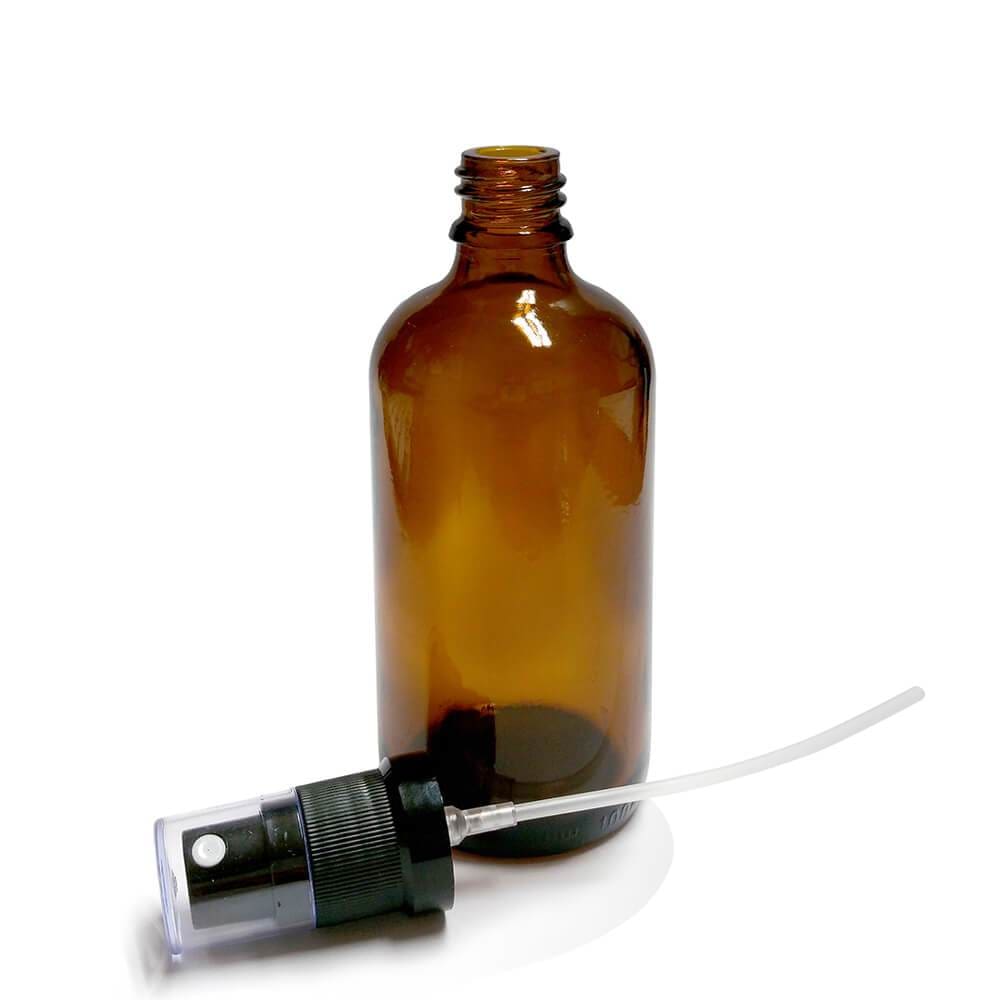 100ml amber glass bottle with black atomiser spray pump and clear protective cap, pump detached and lying beside bottle