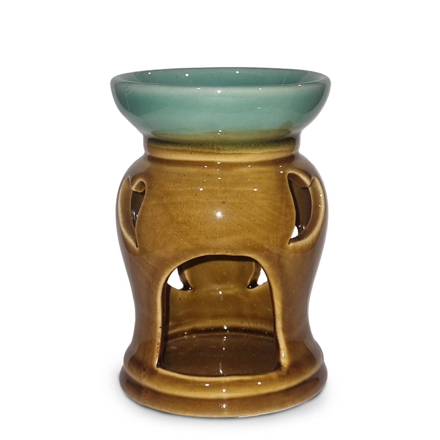 Ceramic oil burner with green top and brown base on a white background