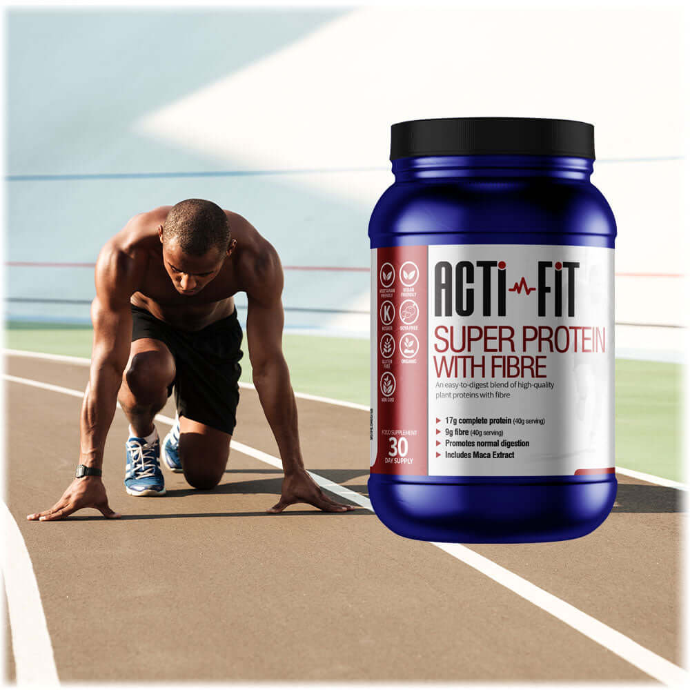 A man on a race track getting ready to sprint with a tub of Super Protein with Fibre in the foreground