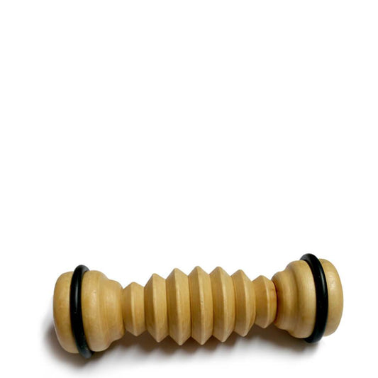Wooden ribbed foot massager with black rubber rings on each end for grip and comfort