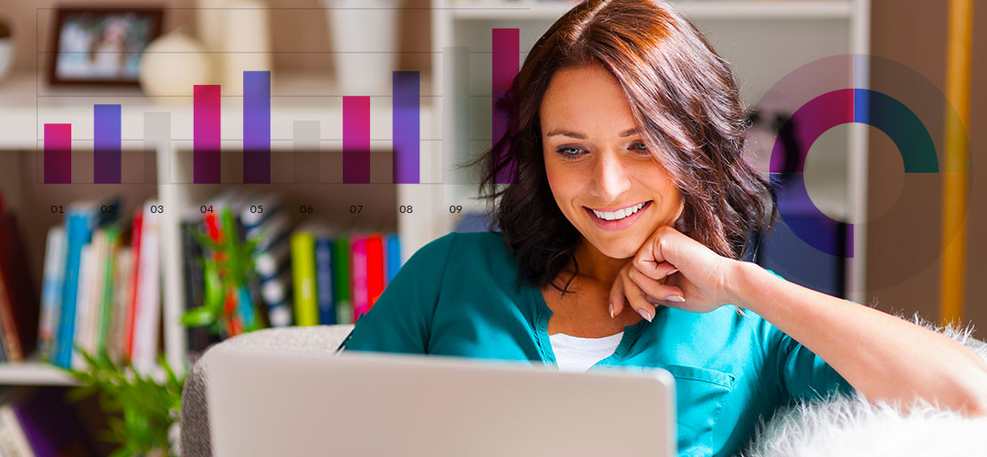 lady with laptop on couch happy with her income