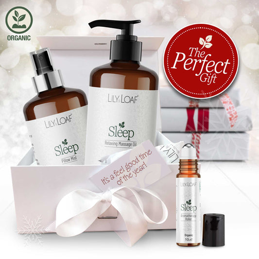 Lily & Loaf sleep product set with massage oil, pillow mist, and roller bottle on a white background.