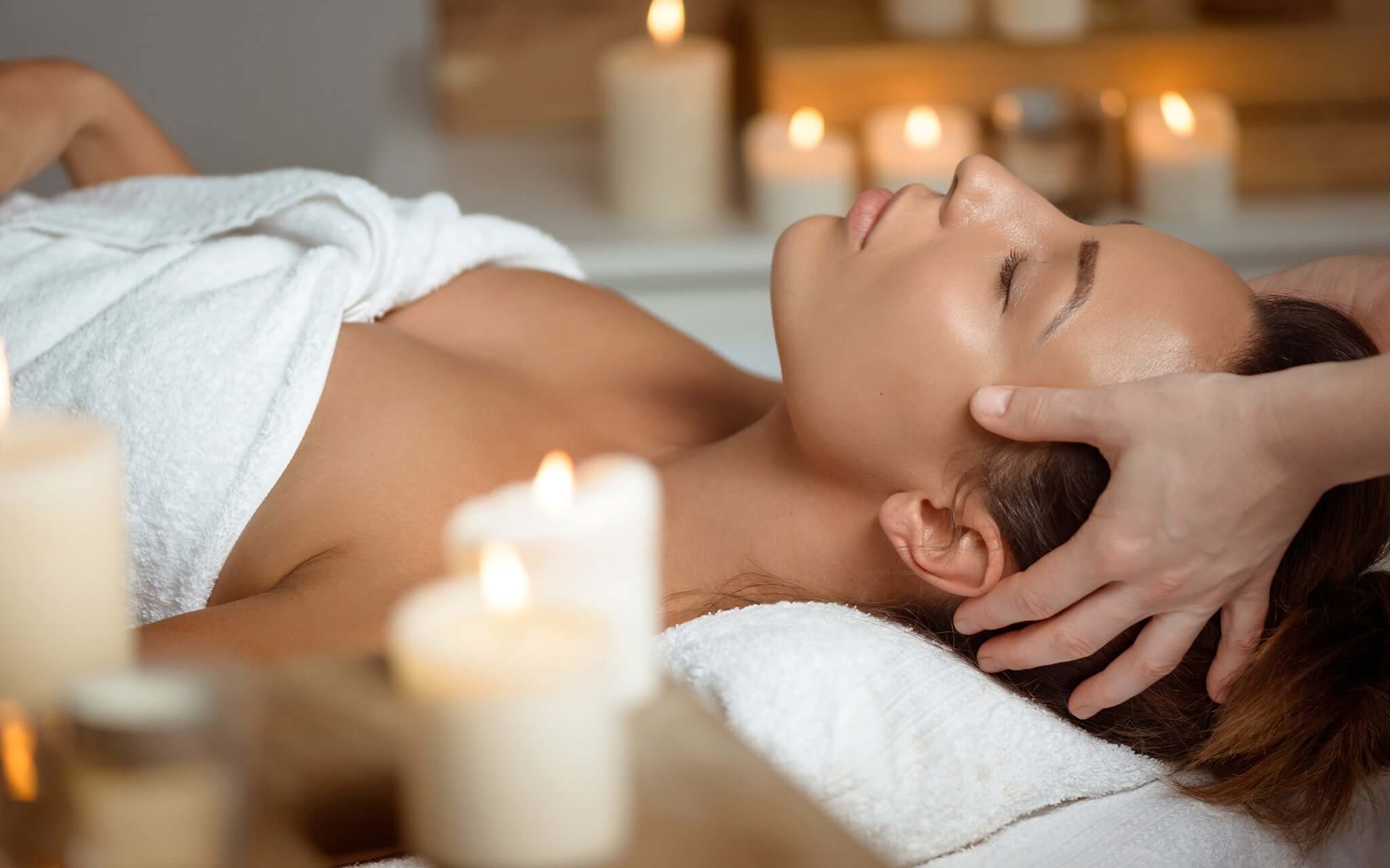 Lady relaxing having a head massage