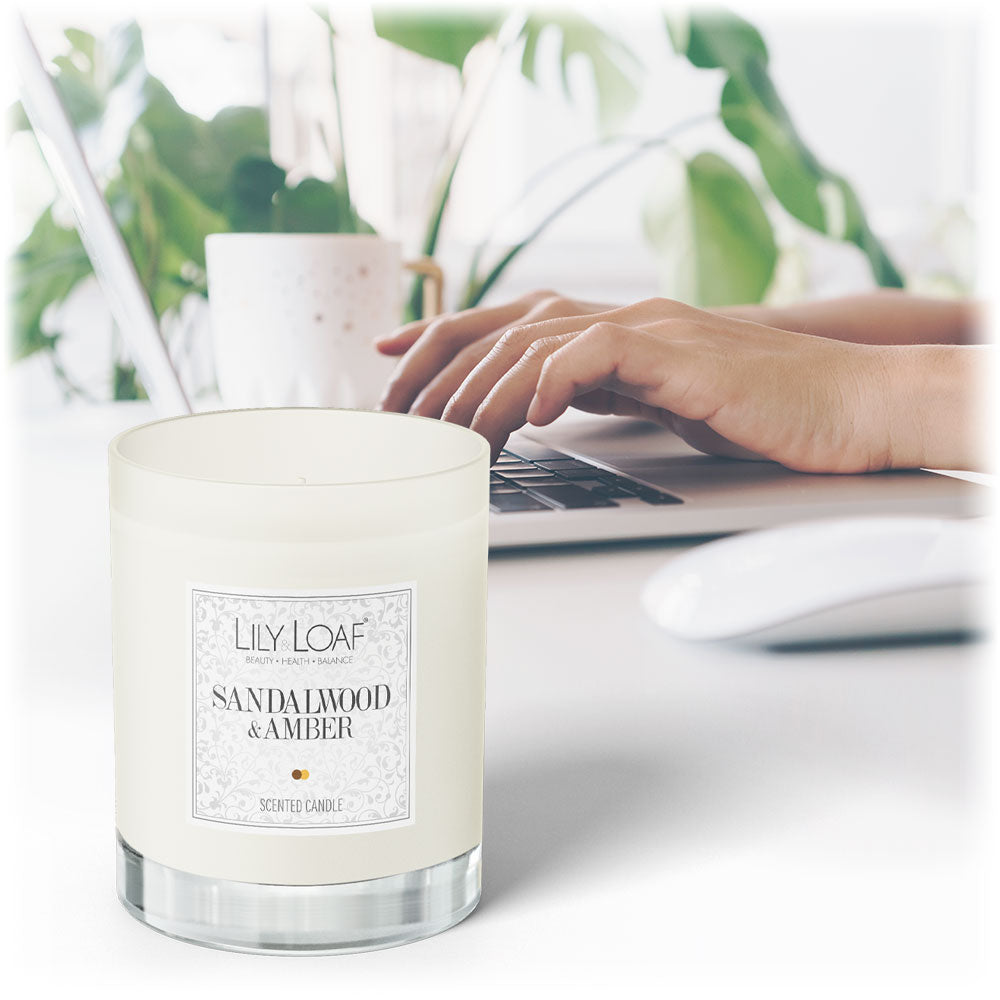 Sandalwood and Amber Soy Wax Candle on an office desk