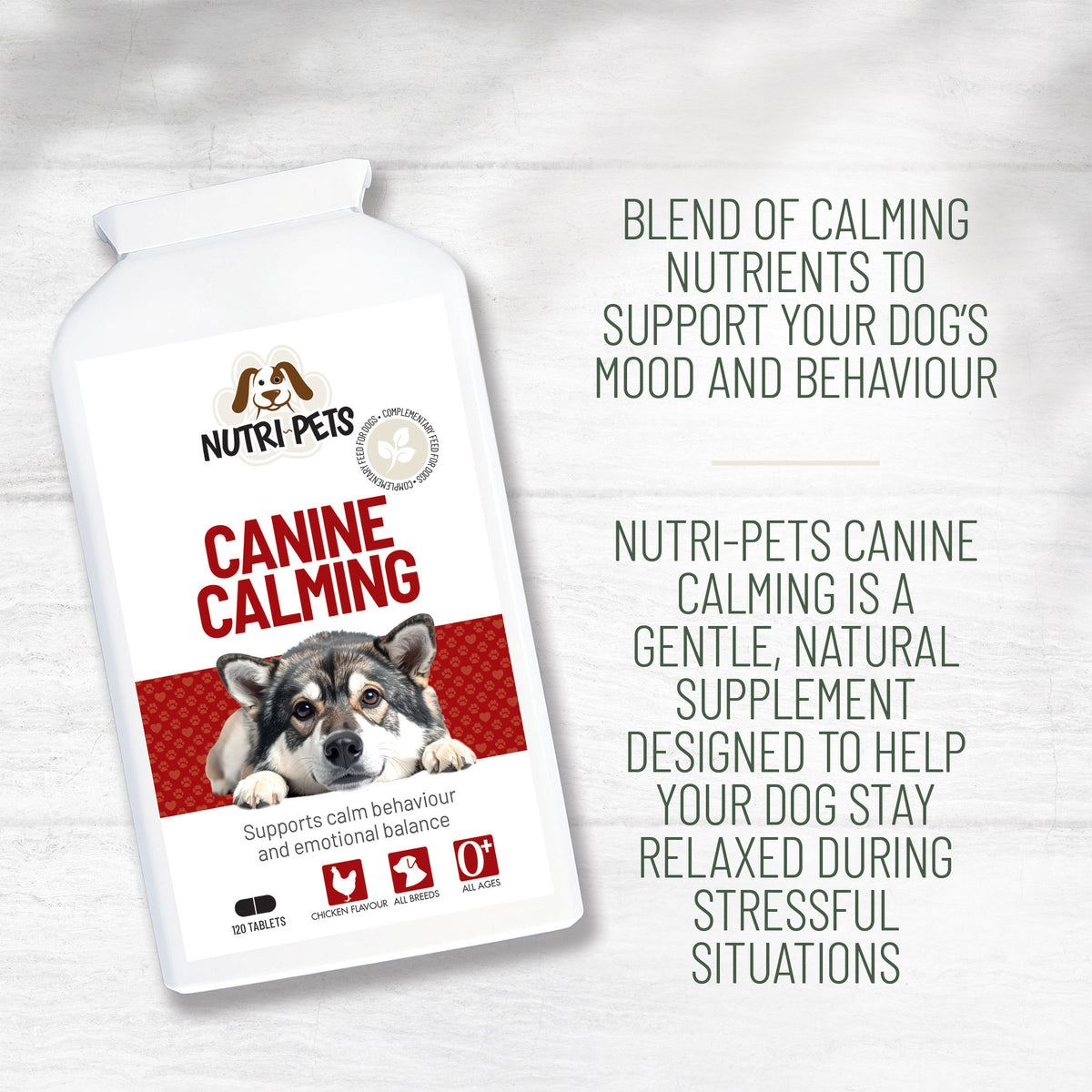 A white bottle of Nutri-Pets Canine Calming supplement shown on a light wood background with green text describing the product benefits.